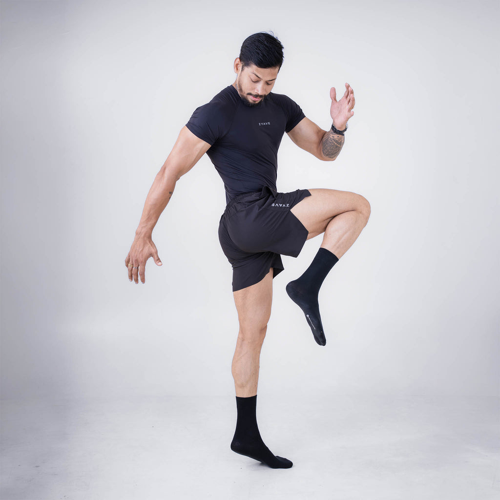 ZYAVE Men's Black Compression T-Shirt - Athletic Action Pose