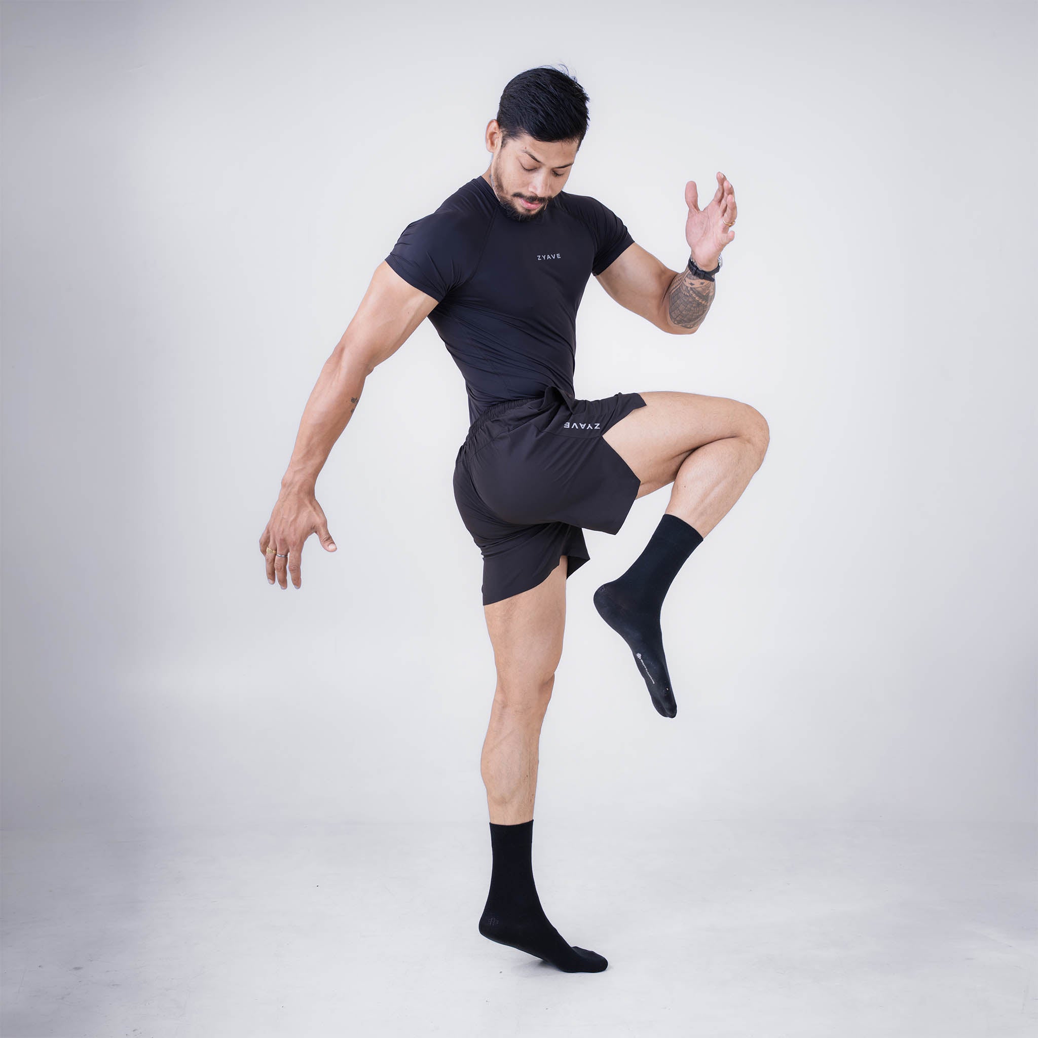 ZYAVE Men's Black Compression T-Shirt - Athletic Action Pose