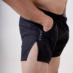 Close-up side view of ZYAVE Men's Onyx Running Shorts featuring a deep side pocket, side split hem and lightweight performance fabric.